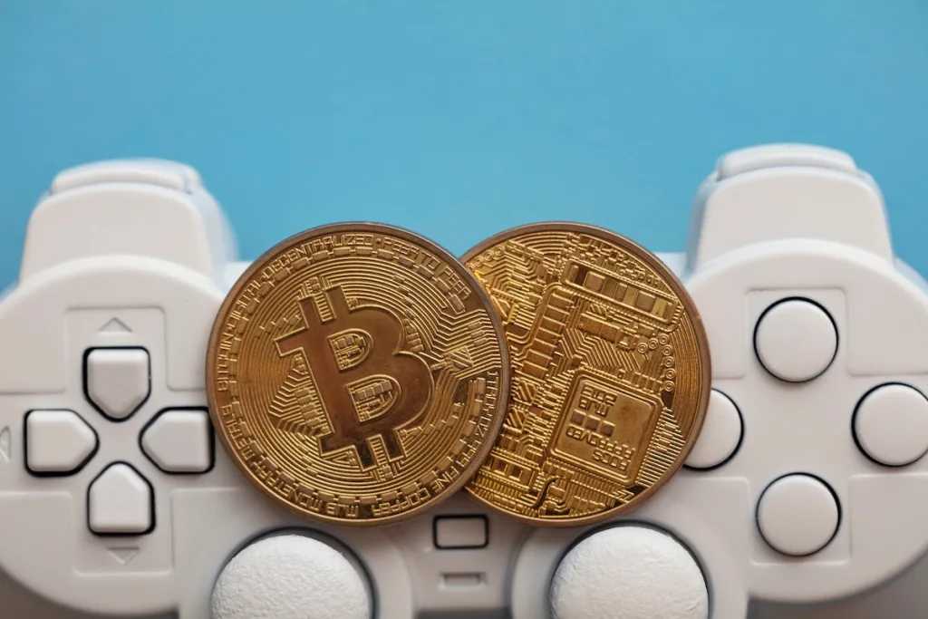 Crypto,Gaming,Concept.,Video,Game,Controller,With,A,Bitcoin,Cryptocurrency